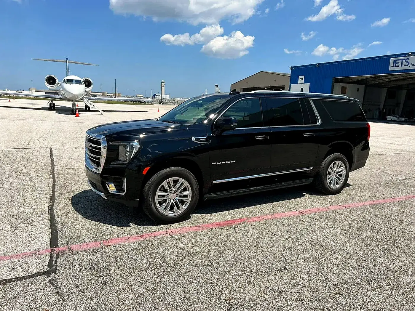 Luxury SUVs at private jet terminals